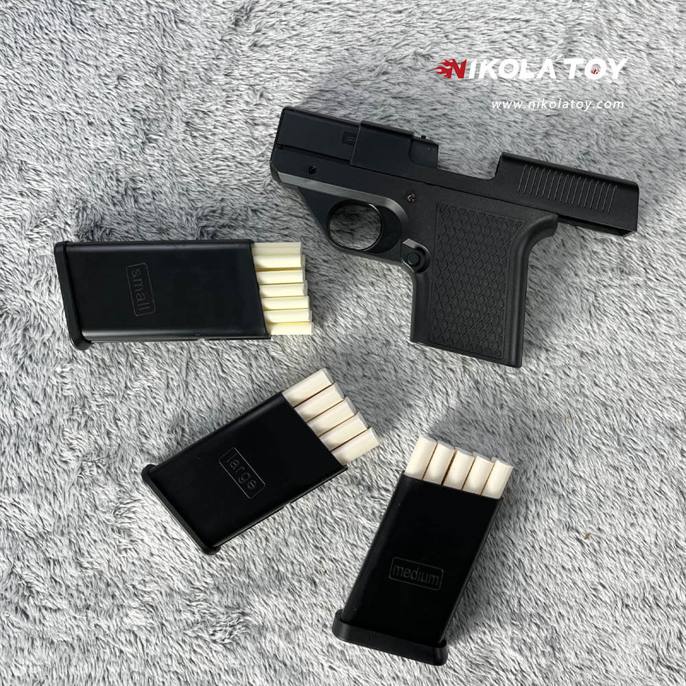 Gun type cigarette lighter with 3 replaceable magazine clips