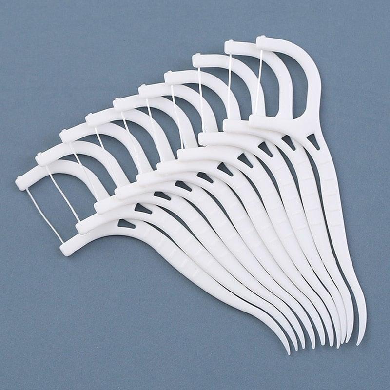 Palillos para usar hilo dental